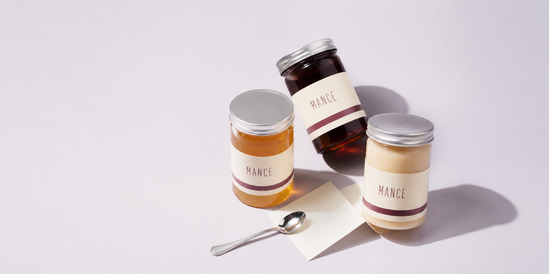Three MANCE honey jars